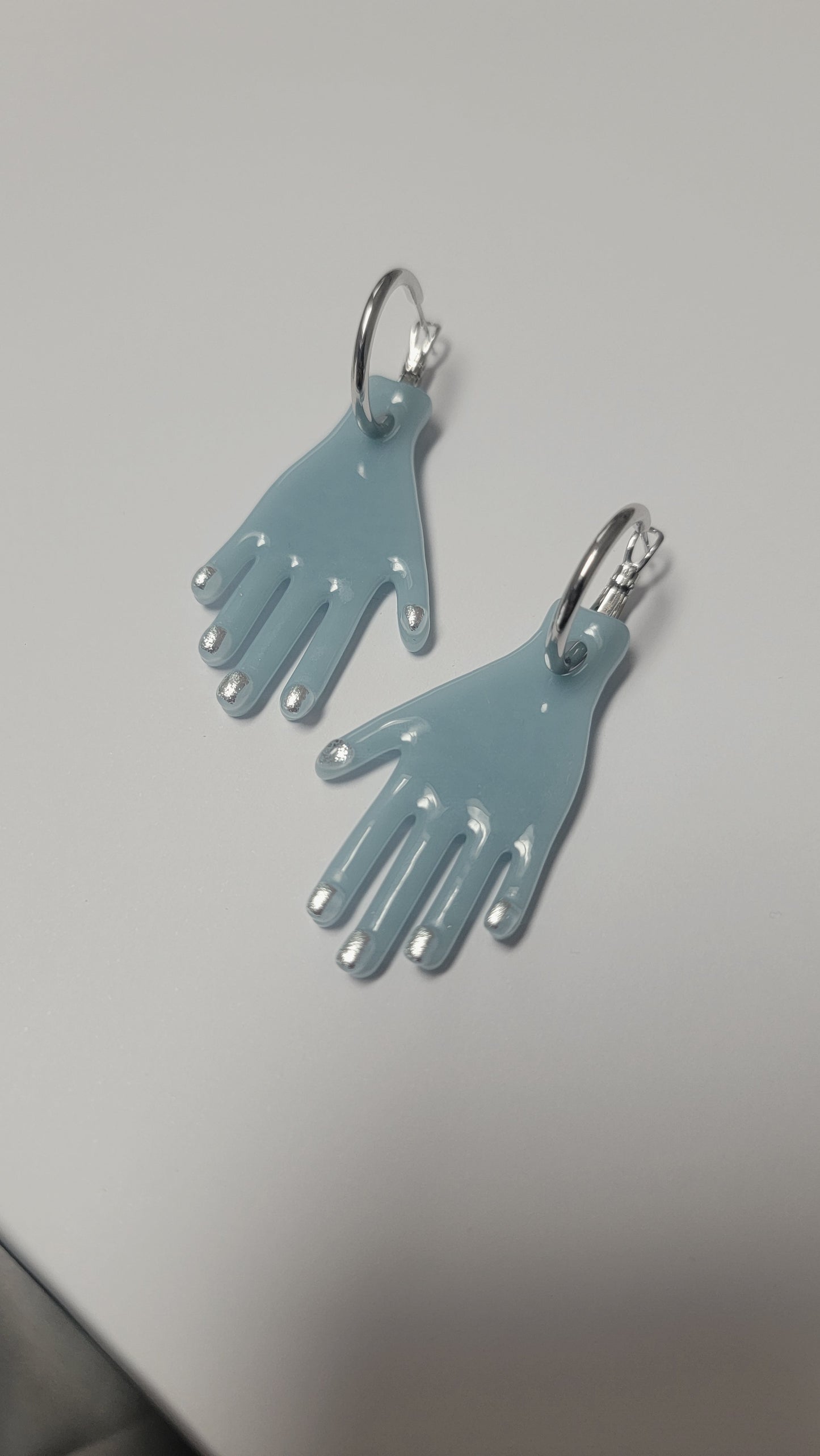 Manitas Azules c/ Uñas Plateadas